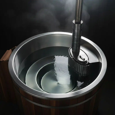 Wooden barrel with metal spigot and steam rising, on a dark background
